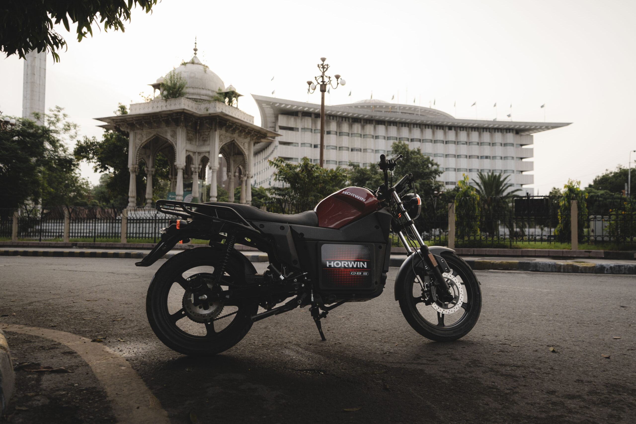 Horwin QB5 Pro electric motorcycle parked street side in an urban setting